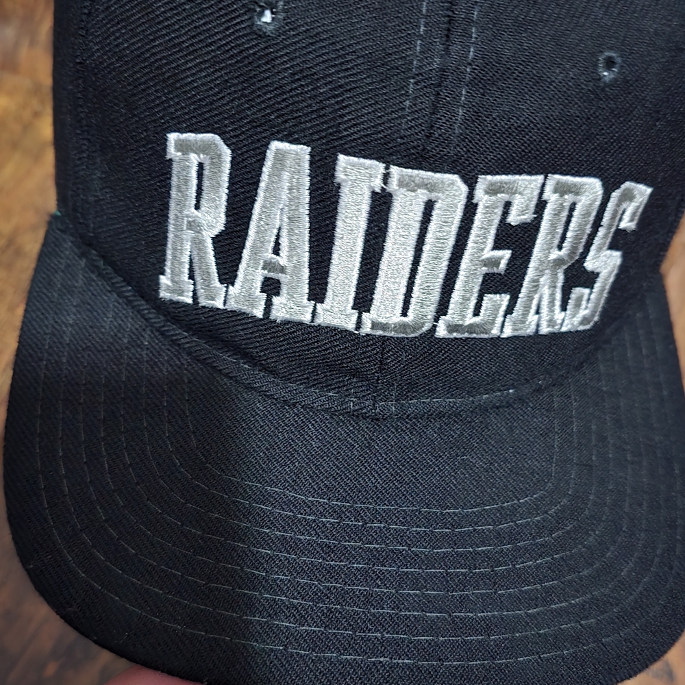 Vintage STARTER Black and Silver Raiders Hat rare Some Scratch Both Side Pannel